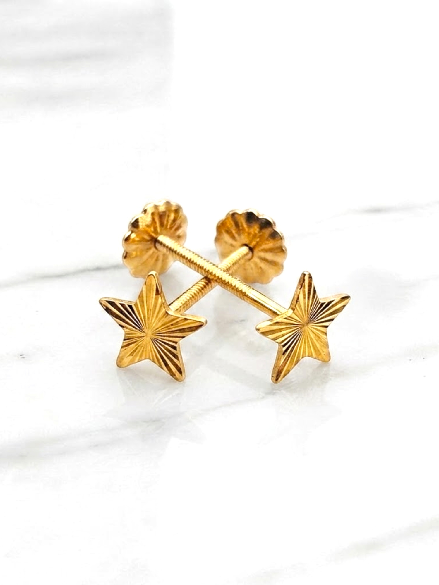 Aros estrellas talladas Oro 18k 1
