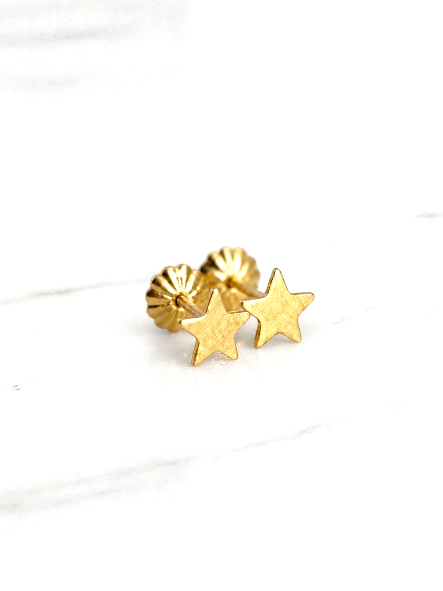 Aros estrellas chicos Oro 18k 1