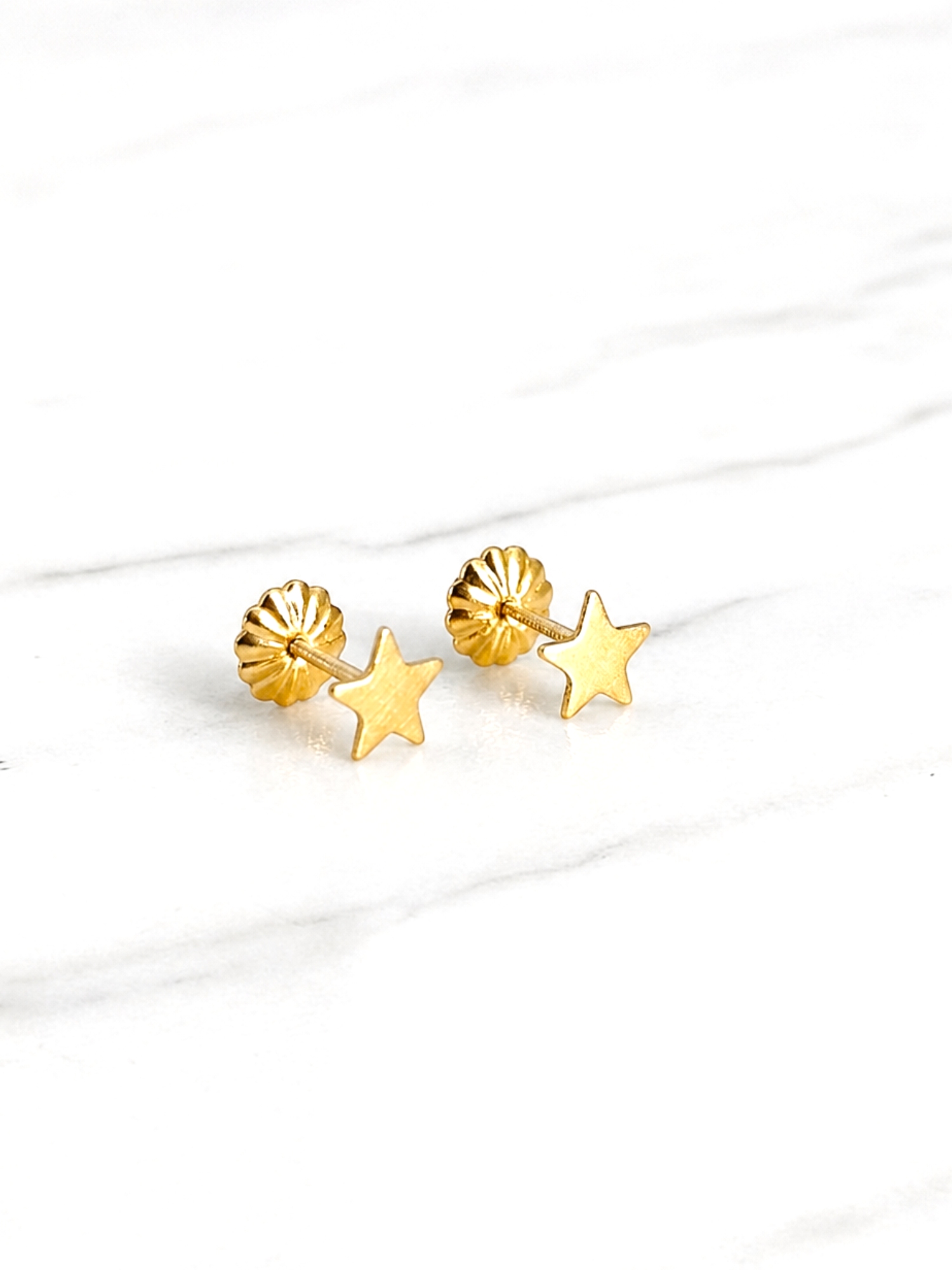 Aros estrellas chicos Oro 18k 2
