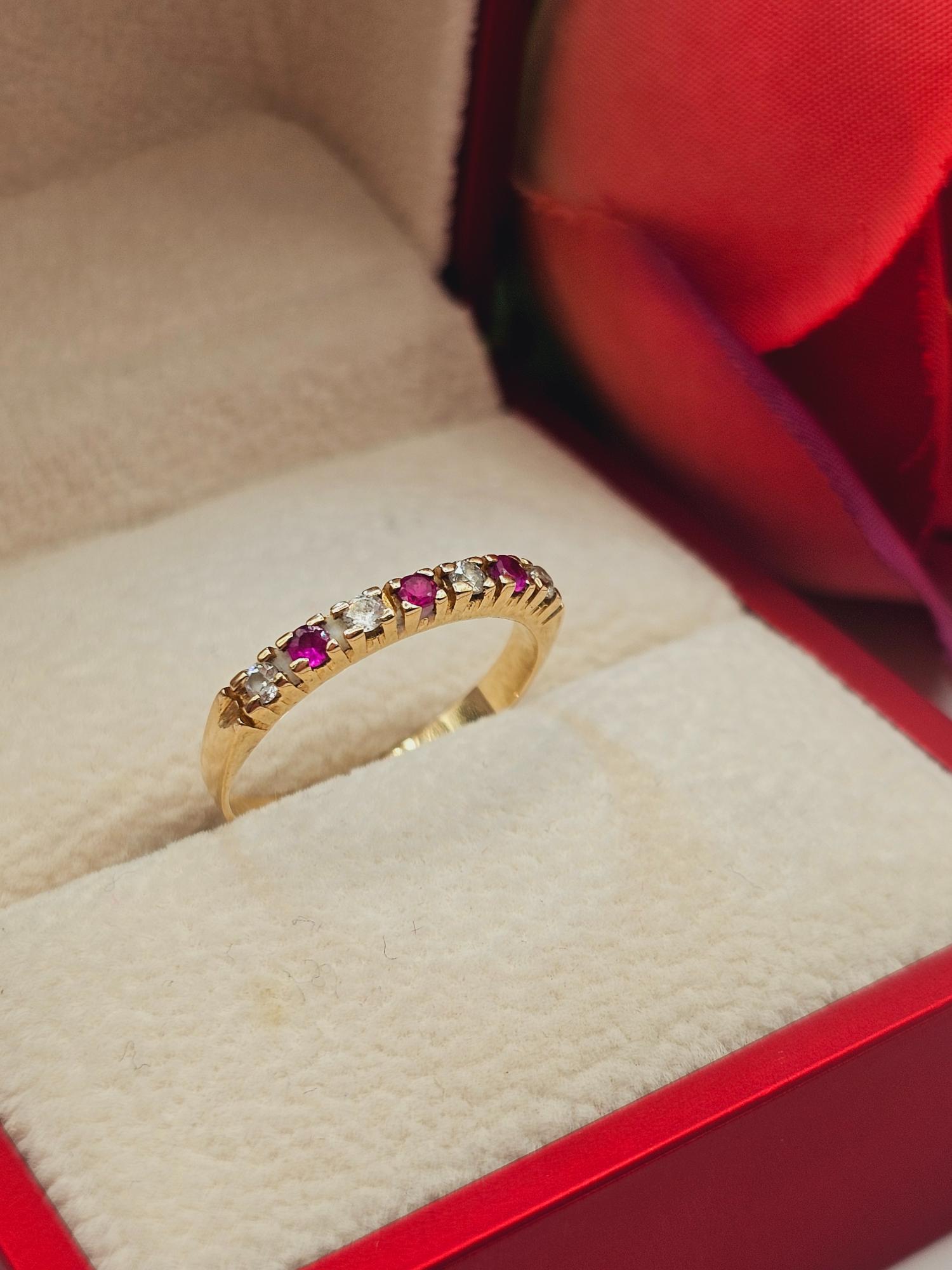 Anillo medio cintillo rubíes y circones 2.8 grs Oro 18k 4