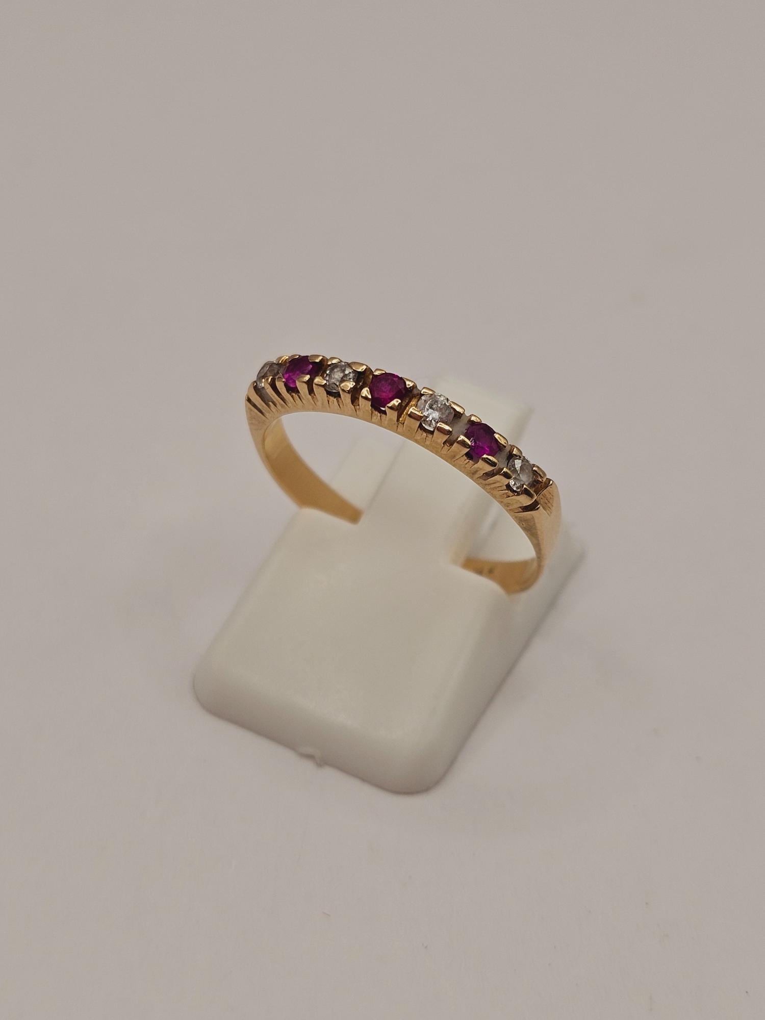 Anillo medio cintillo rubíes y circones 2.8 grs Oro 18k 5