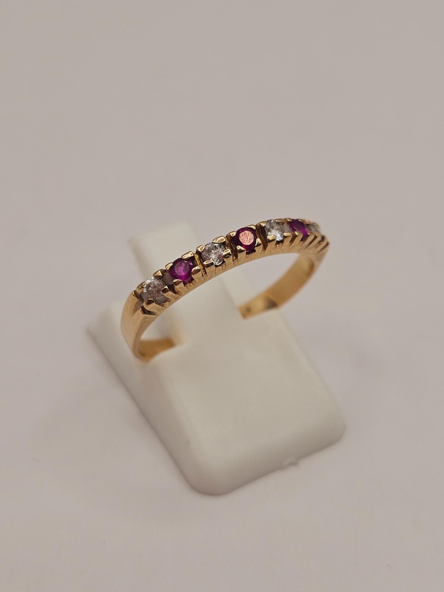 Anillo medio cintillo rubíes y circones 2.8 grs Oro 18k 6