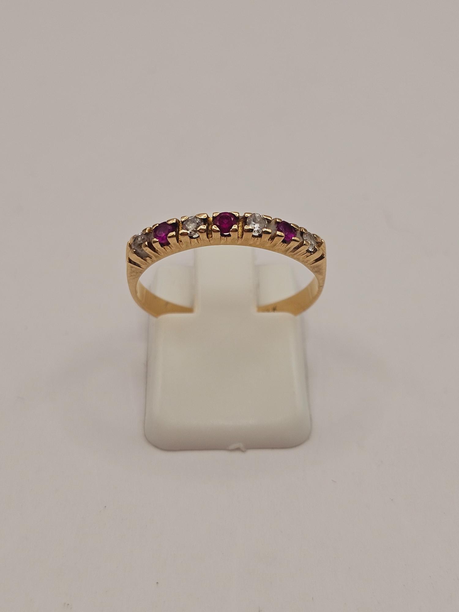Anillo medio cintillo rubíes y circones 2.8 grs Oro 18k 7
