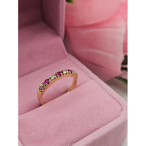Anillo medio cintillo rubíes y circones 2.8 grs Oro 18k