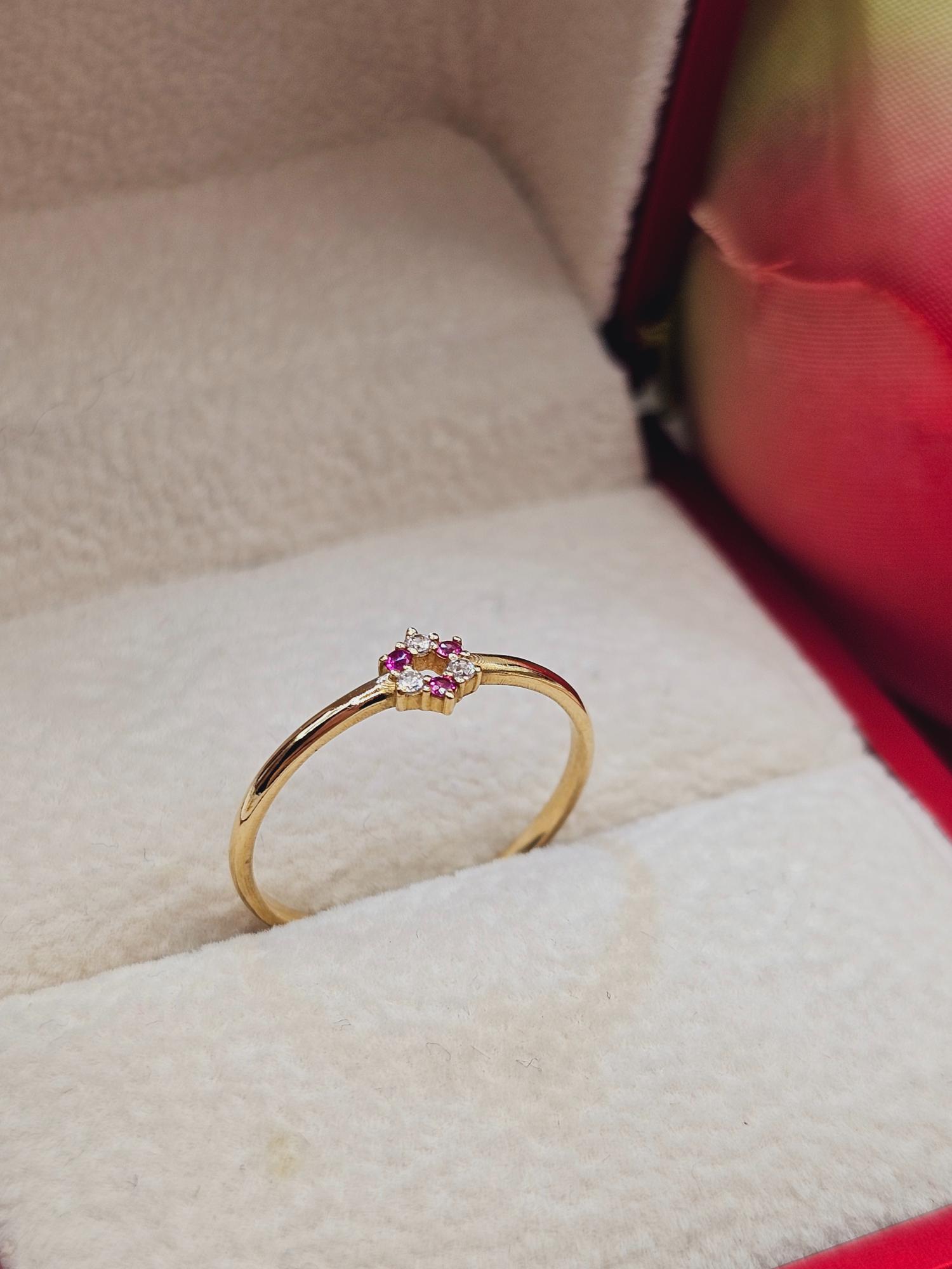 Anillo roseta rubíes y circones 1.6 grs Oro 18k 1