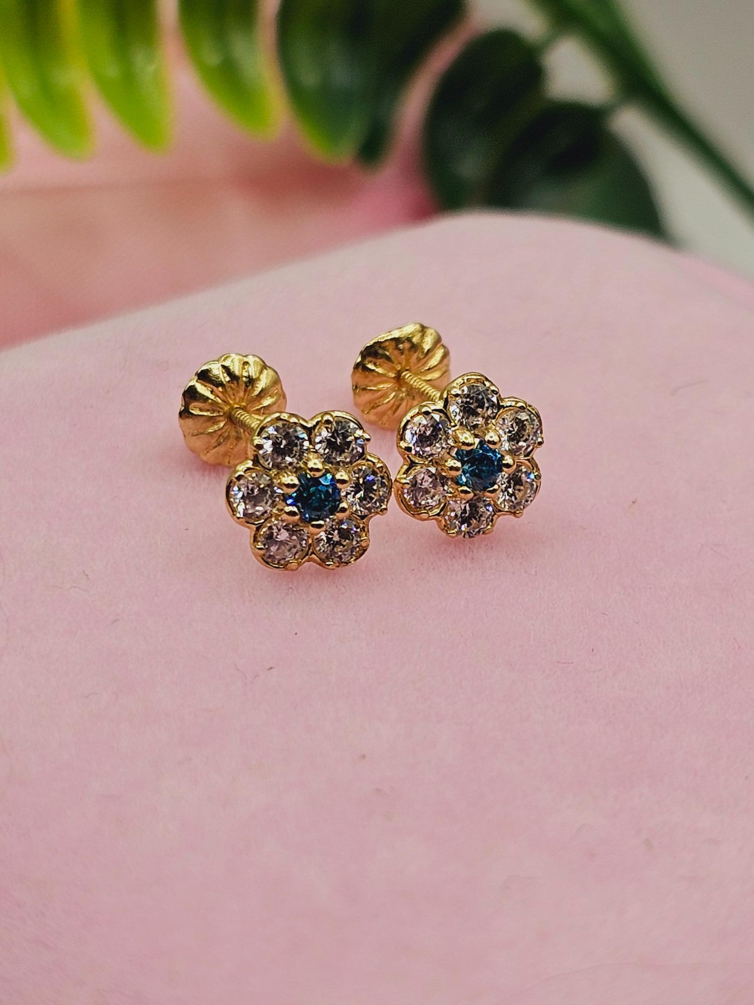 Aros roseta con circones y agua marina 7 mm 1.2 grs Oro 18k 1