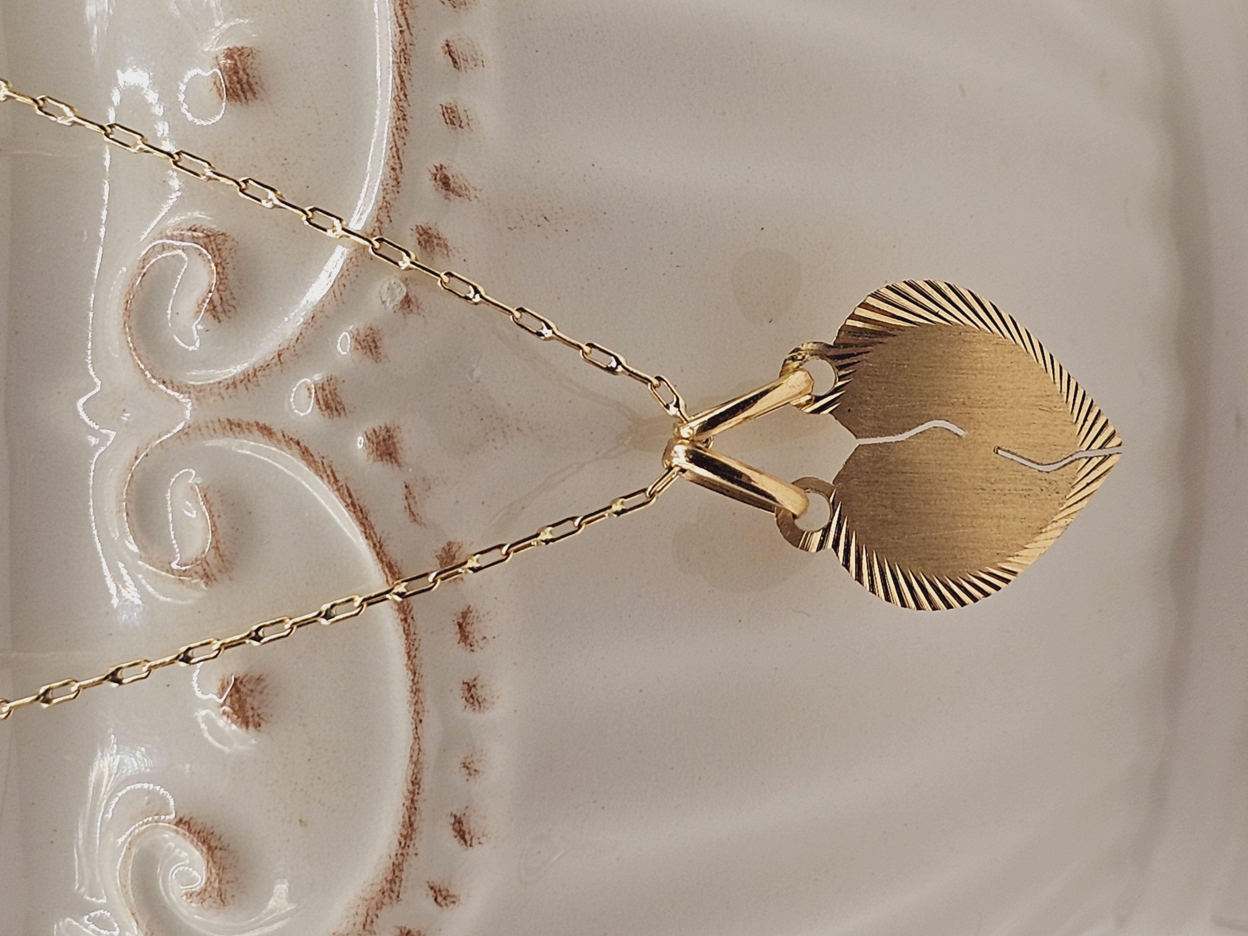 Cadena limada 50 cm y corazón partido 16 mm 3.2 grs Oro 18k 2