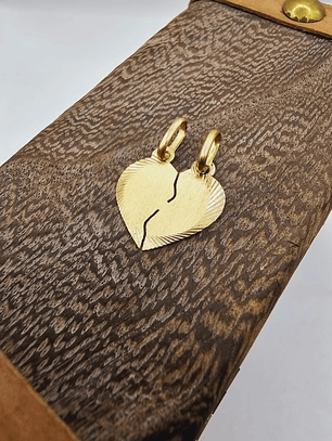 Colgante corazón partido 11 mm 1.2 grs Oro 18k