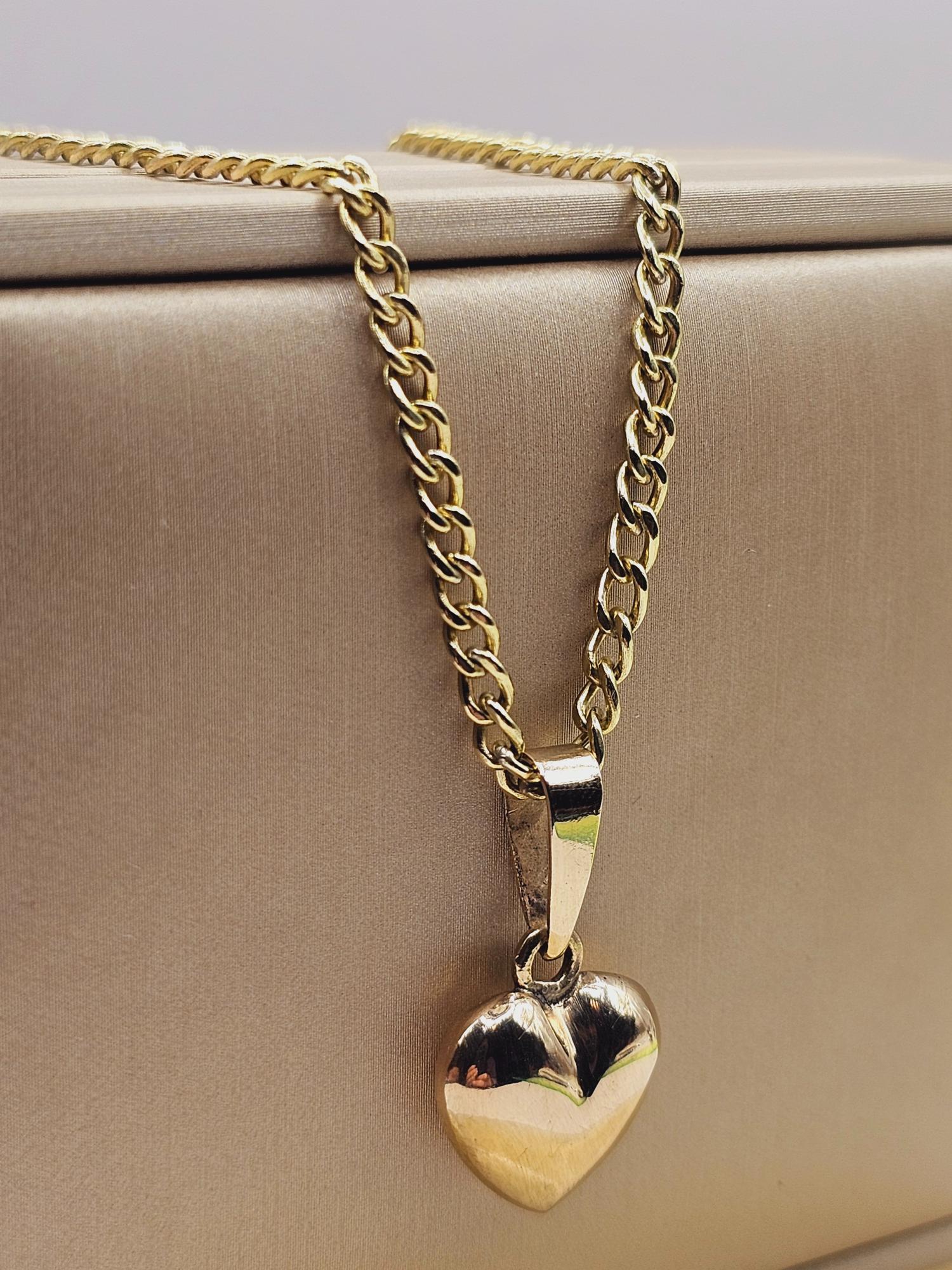 Cadena grumete 55 cm y corazón 28 mm 19 grs Oro 18k 6