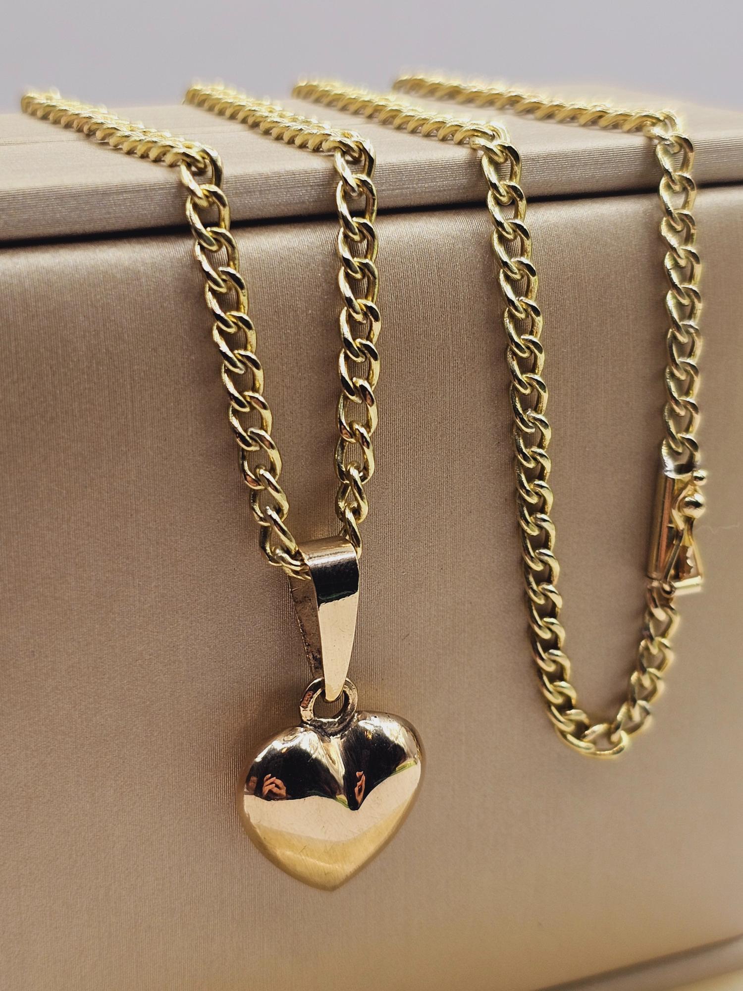 Cadena grumete 55 cm y corazón 28 mm 19 grs Oro 18k 2