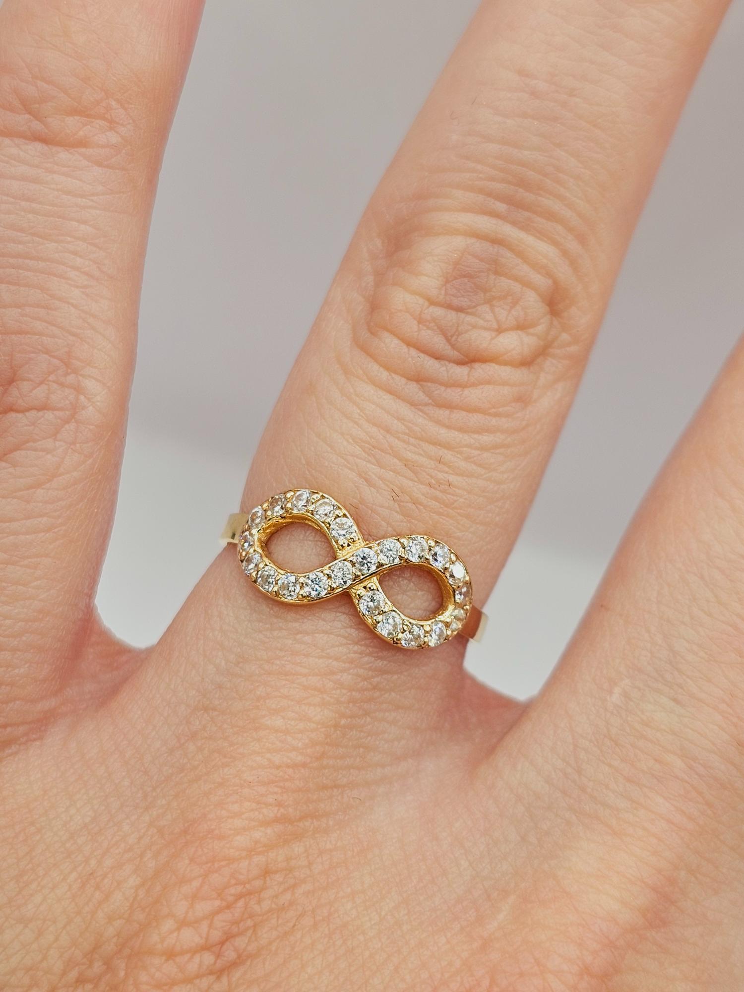 Anillo infinito con circones 1.7 grs Oro 18k 3