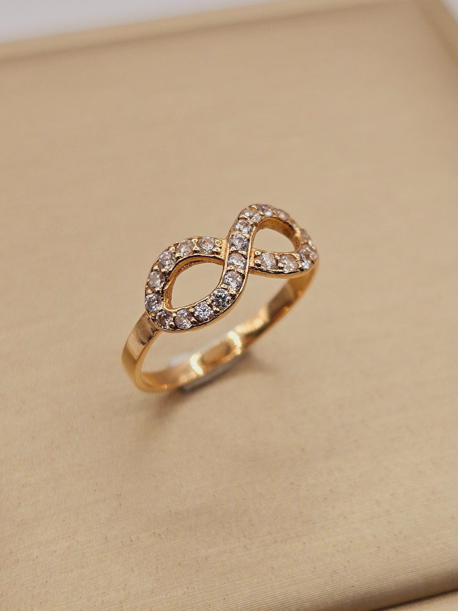 Anillo infinito con circones 1.7 grs Oro 18k 5