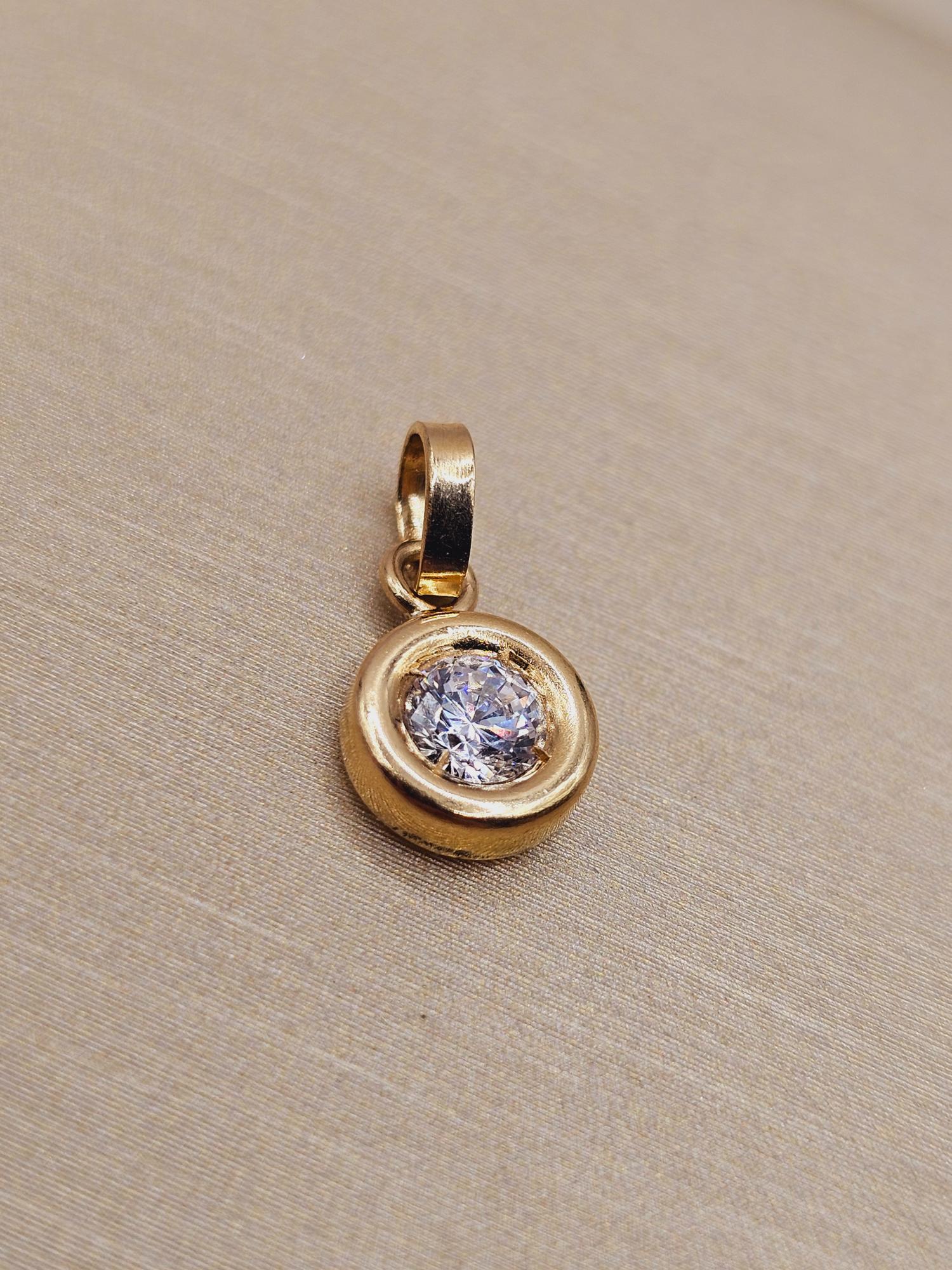 Colgante punto de luz 1.1 cm 0.7 grs Oro 18k 2