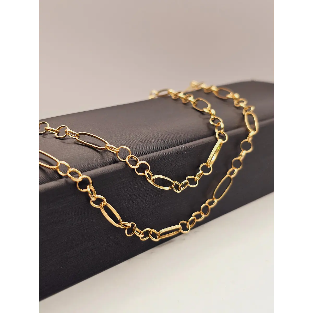 Cadena rolo facetado 60 cm 9 grs Oro 18k