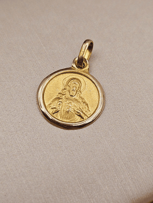 Colgante medalla sagrado corazón 15 mm 1.7 grs Oro 18k