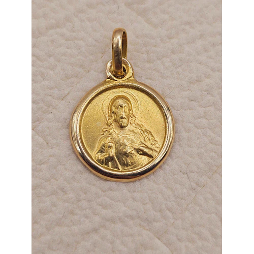 Colgante medalla sagrado corazón 15 mm 1.7 grs Oro 18k