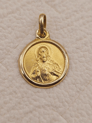 Colgante medalla sagrado corazón 15 mm 1.7 grs Oro 18k