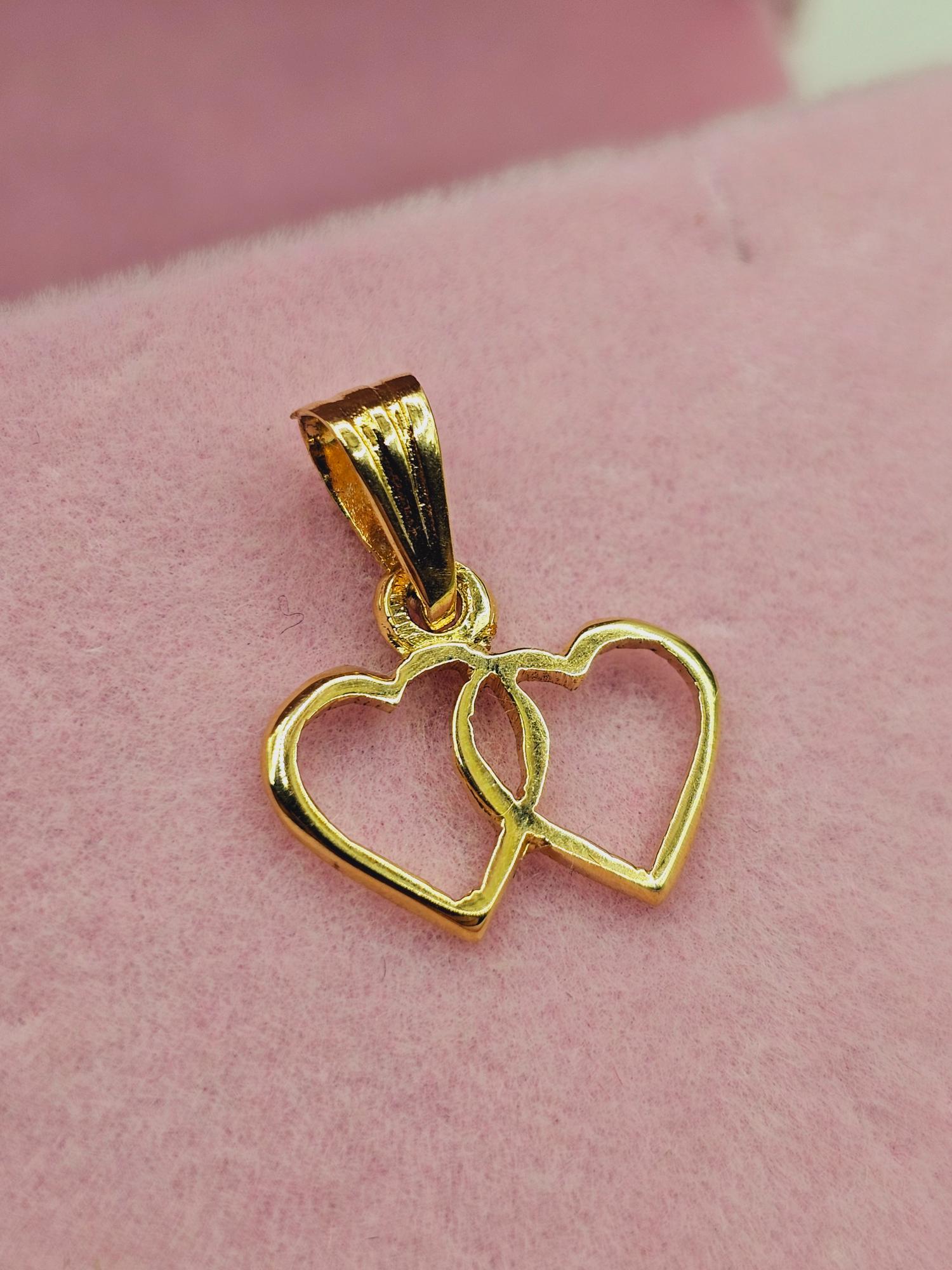 Colgante silueta doble corazón 1.7 cm 0.9 grs Oro 18k 1