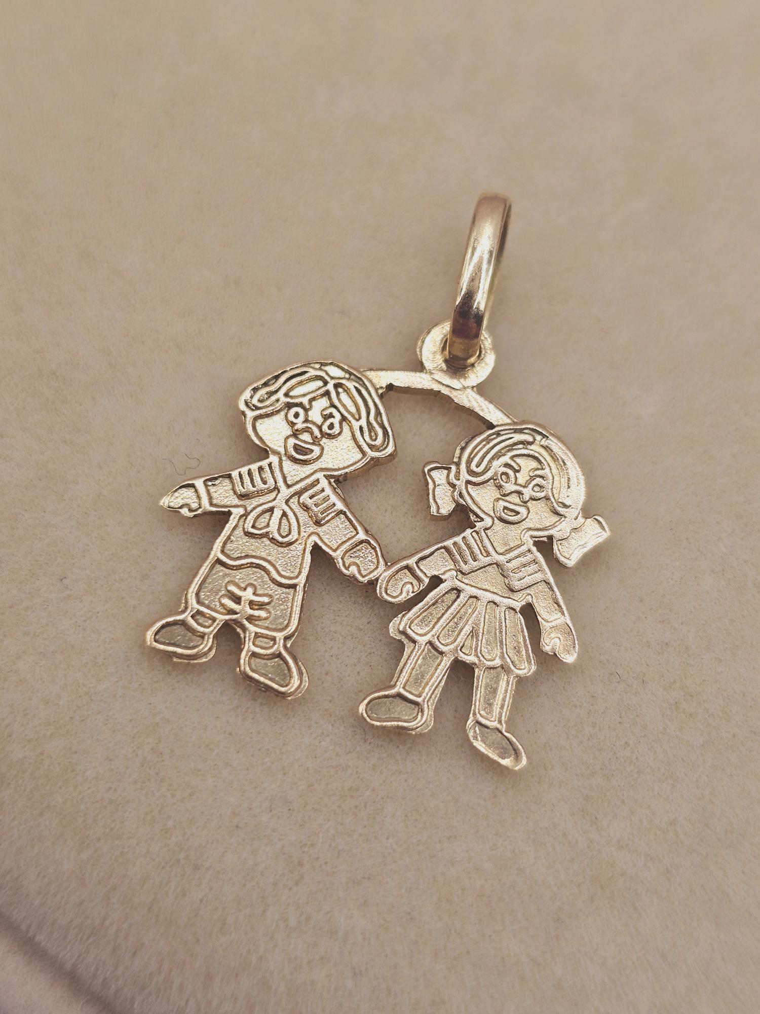Colgante niña y niño 2.3 cm 1.6 grs Oro 18k 1