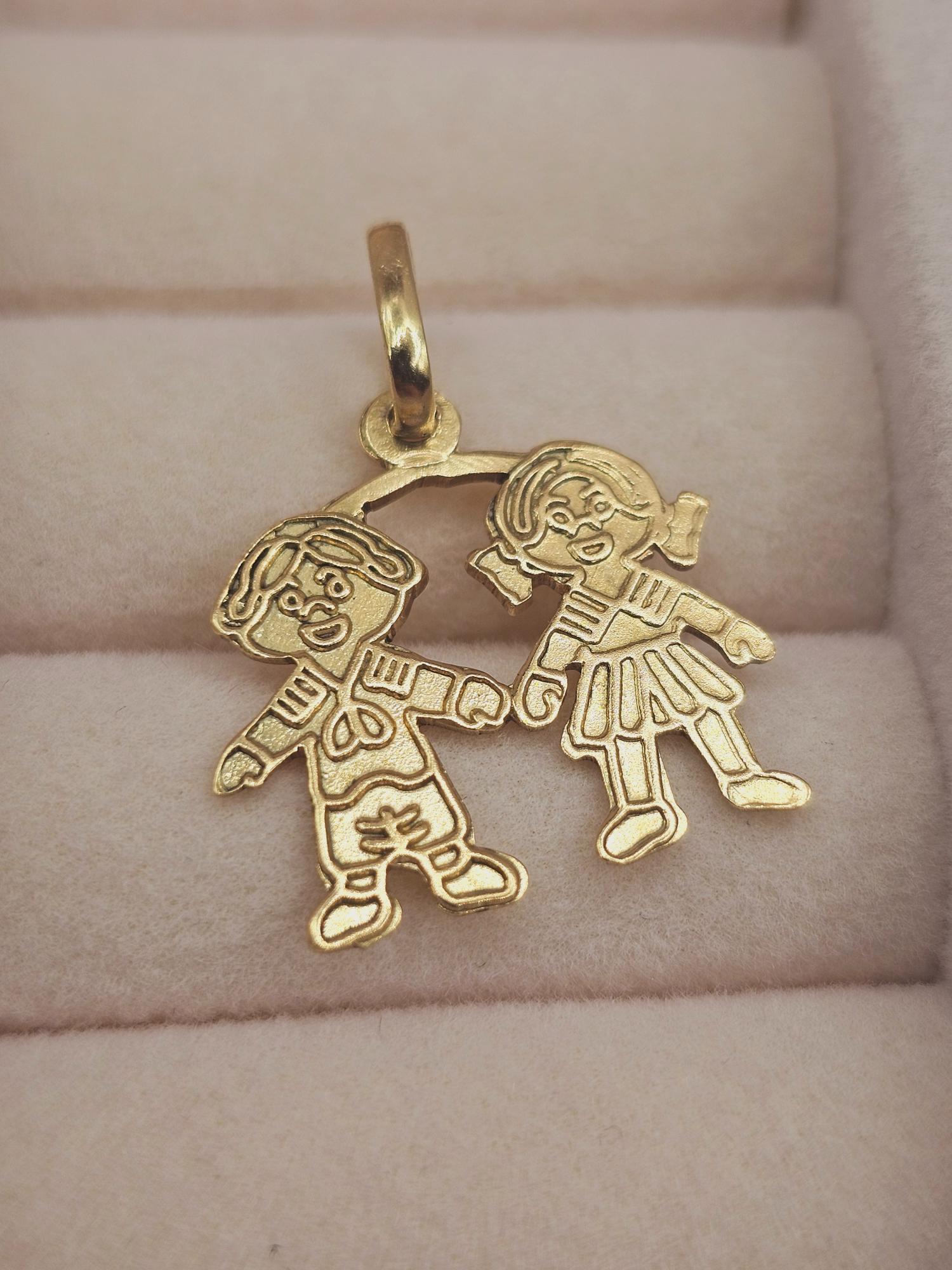 Colgante niña y niño 2.3 cm 1.6 grs Oro 18k 2