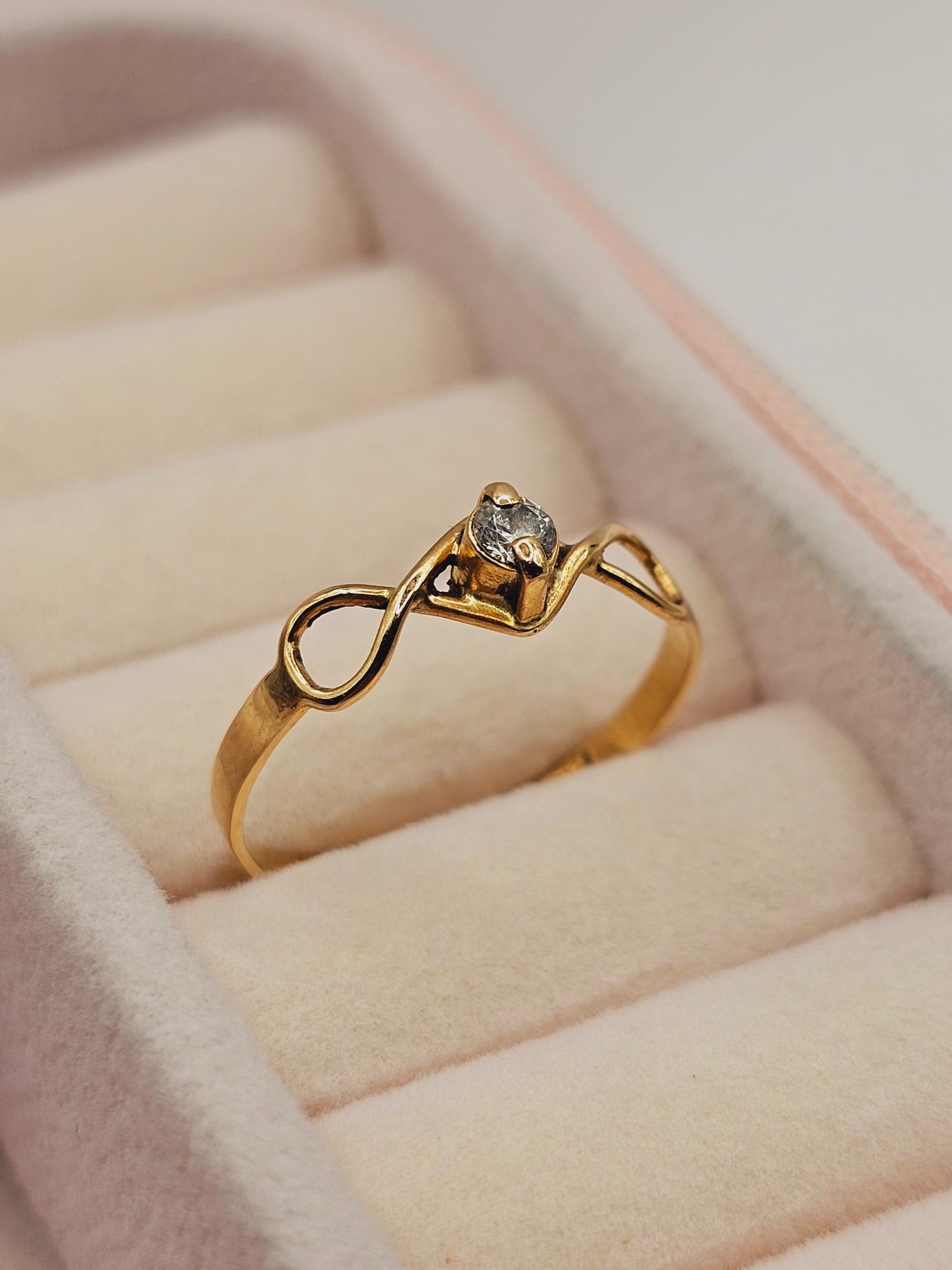 Anillo Infinito circón 1.5 grs Oro 18k 1