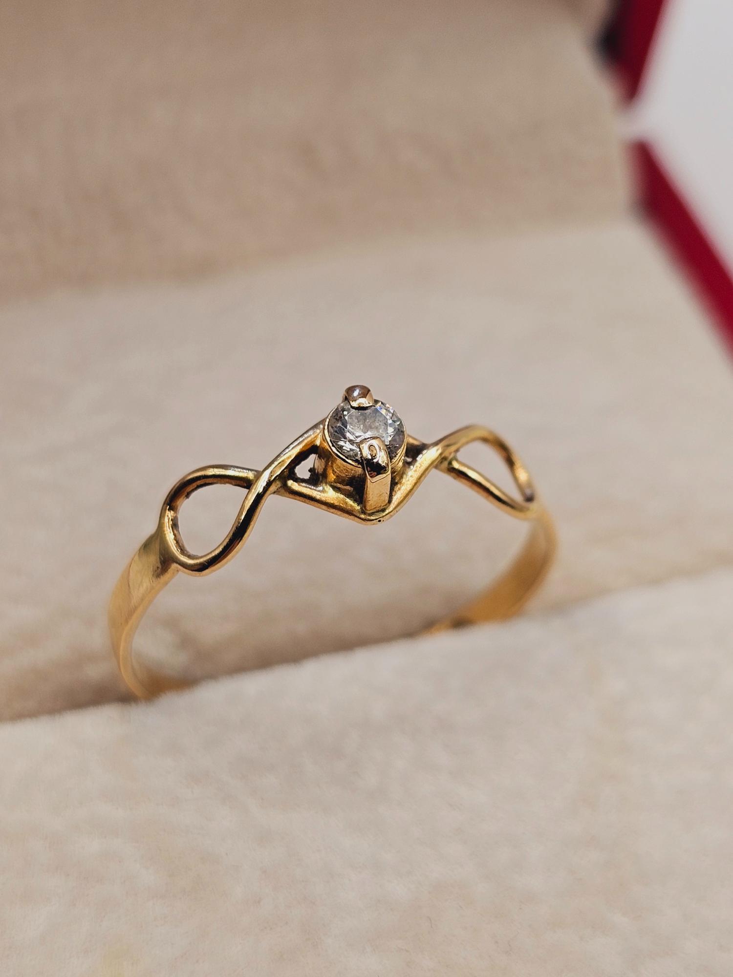 Anillo Infinito circón 1.5 grs Oro 18k 5