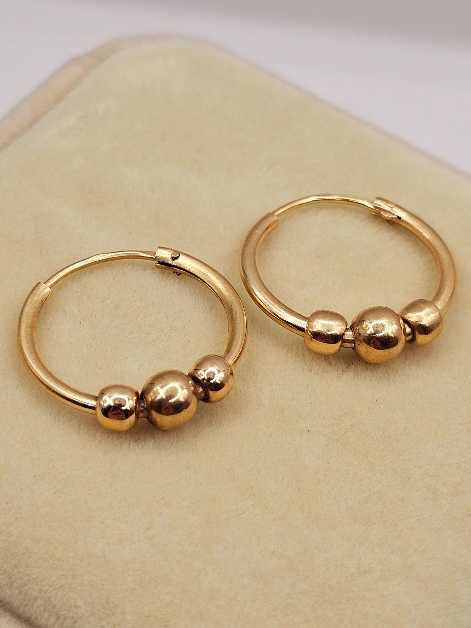 Aros argolla tubo bolitas 2 cm 2.2 grs Oro 18k 5