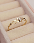 Anillo silueta tres corazones circón 0.7 grs Oro 18k