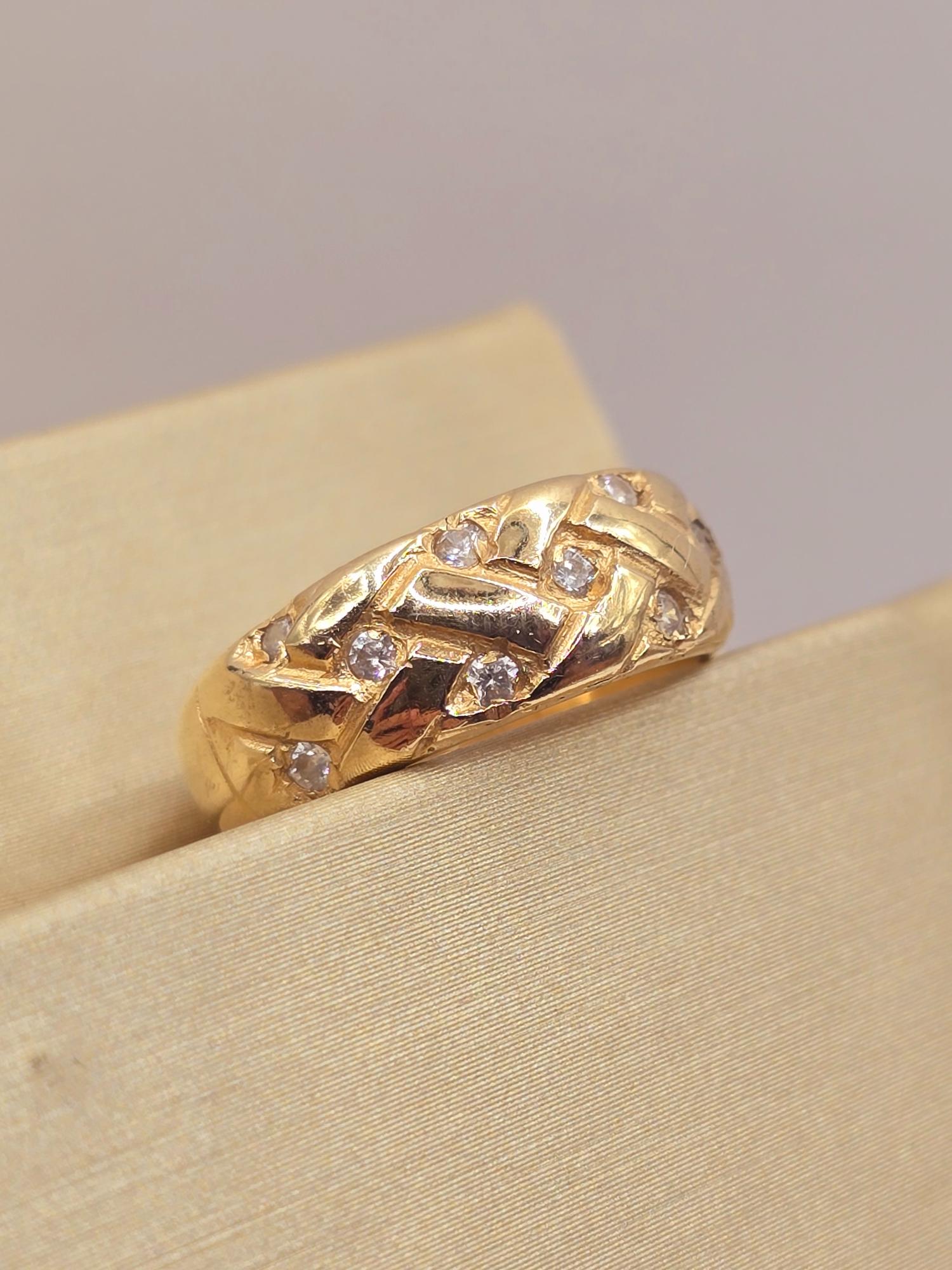 Anillo trenza circones 4.7 grs Oro 18k 4