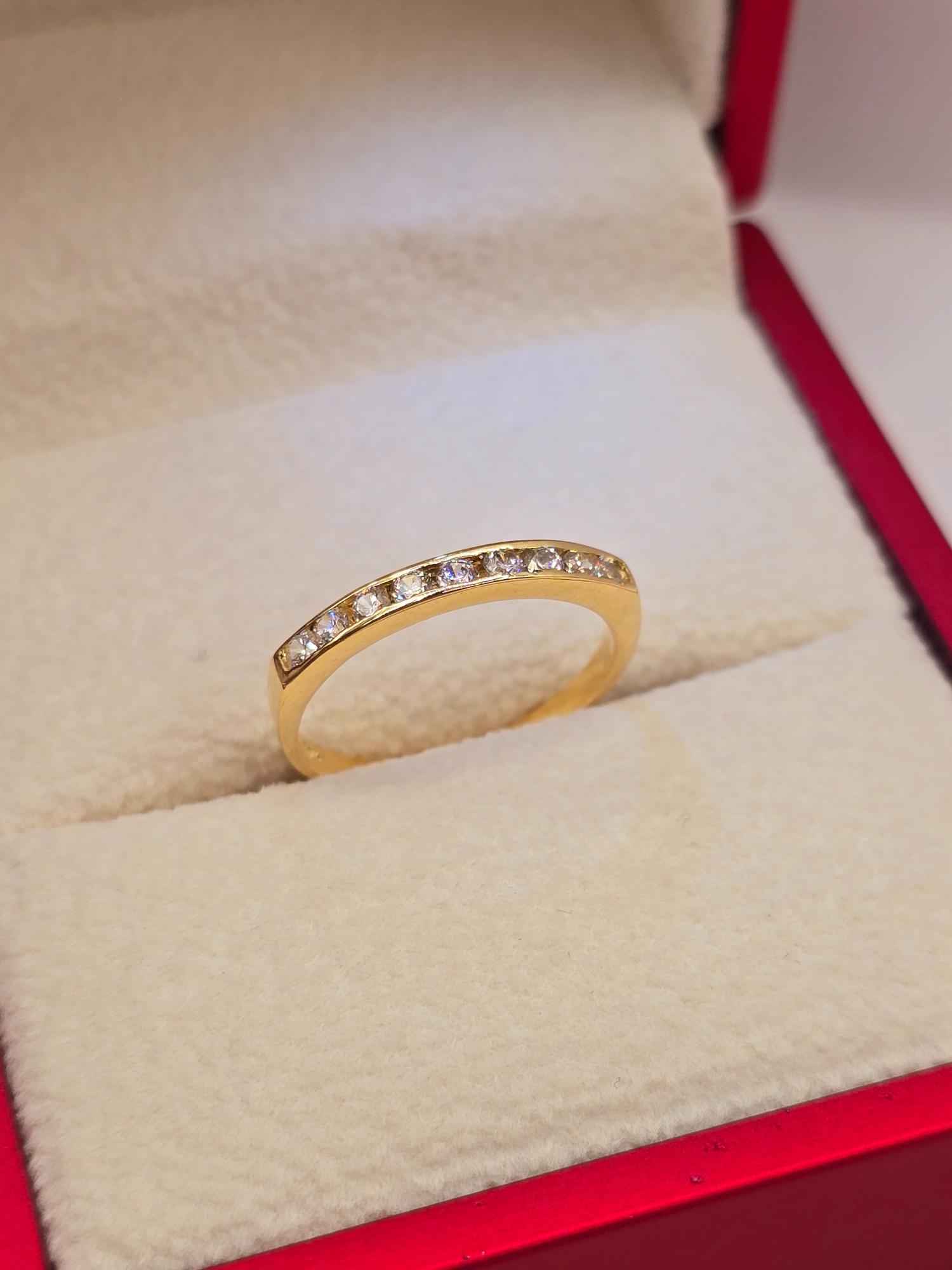 Anillo medio cintillo circones 2 grs Oro 18k 2