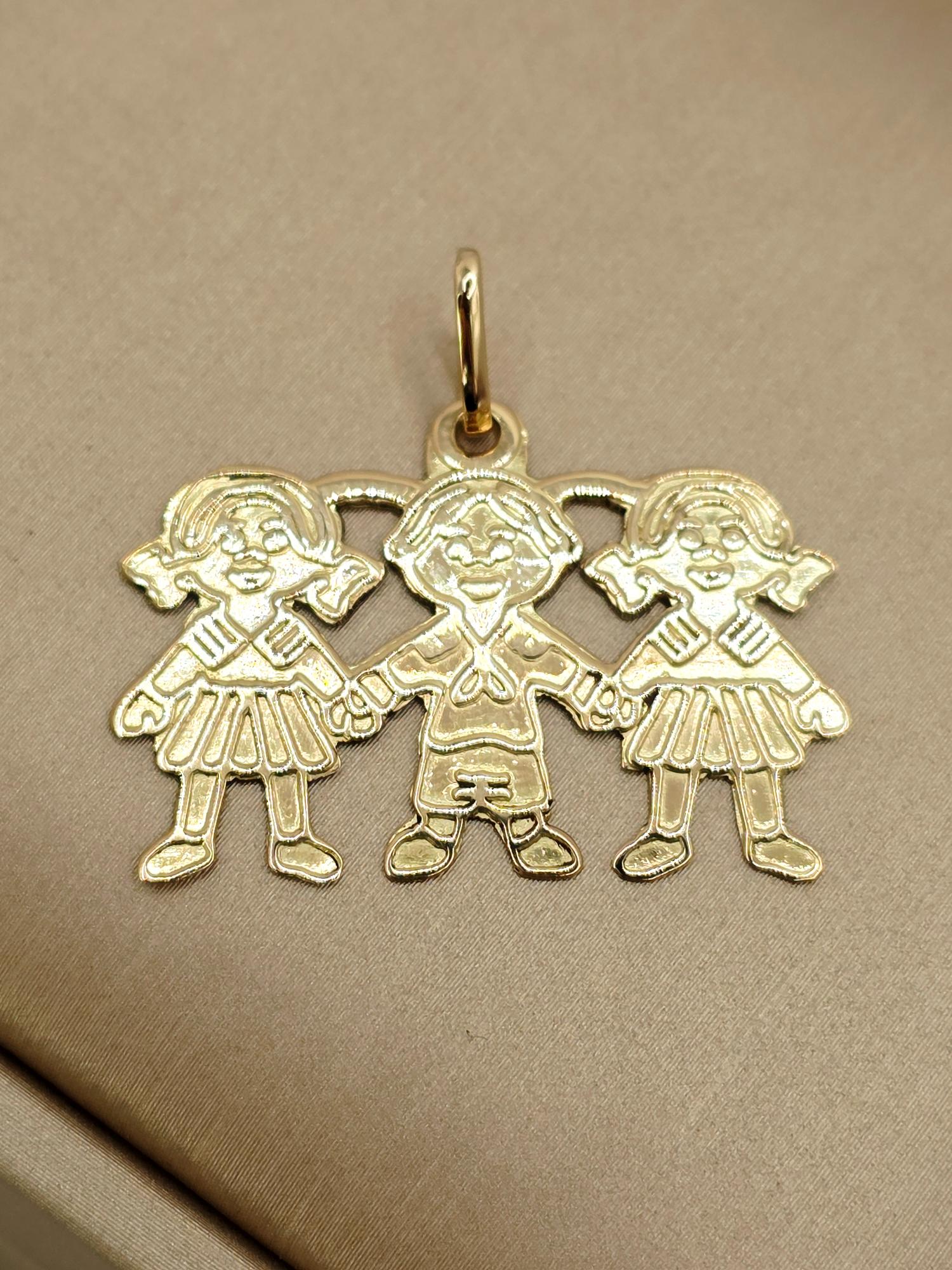 Colgante tres niñ@s 3 cm 2.7 grs Oro 18k 1
