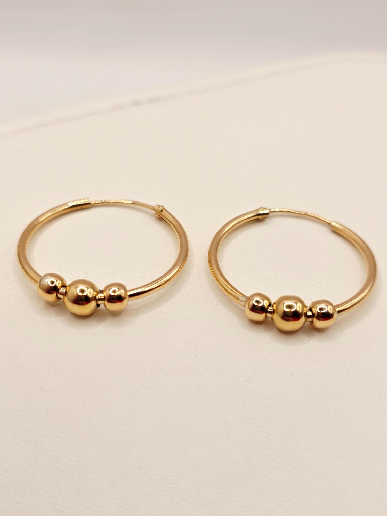 Aros tubo bolas 2.5 cm 2.7 grs Oro 18k 3