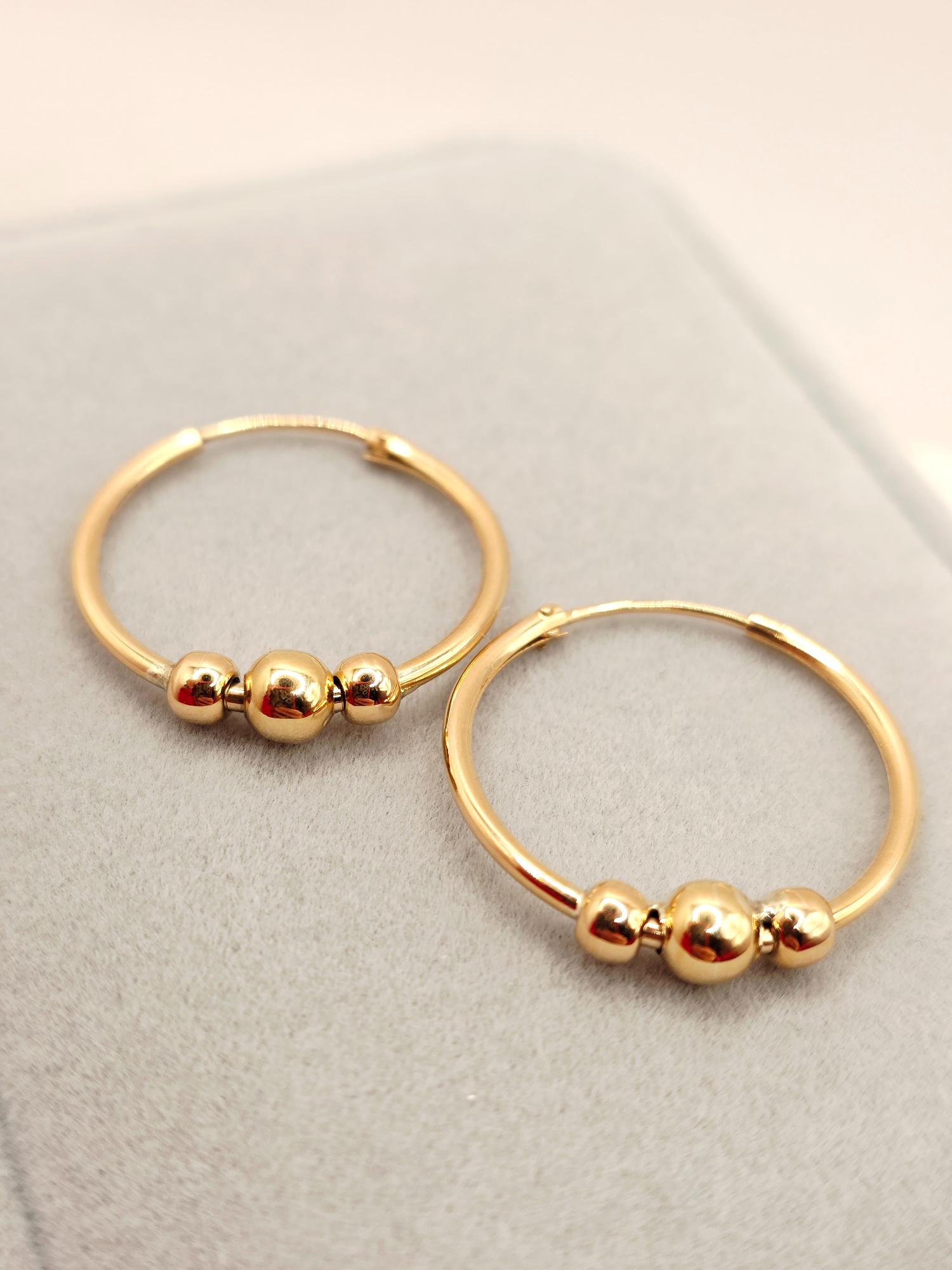 Aros tubo bolas 2.5 cm 2.7 grs Oro 18k 4