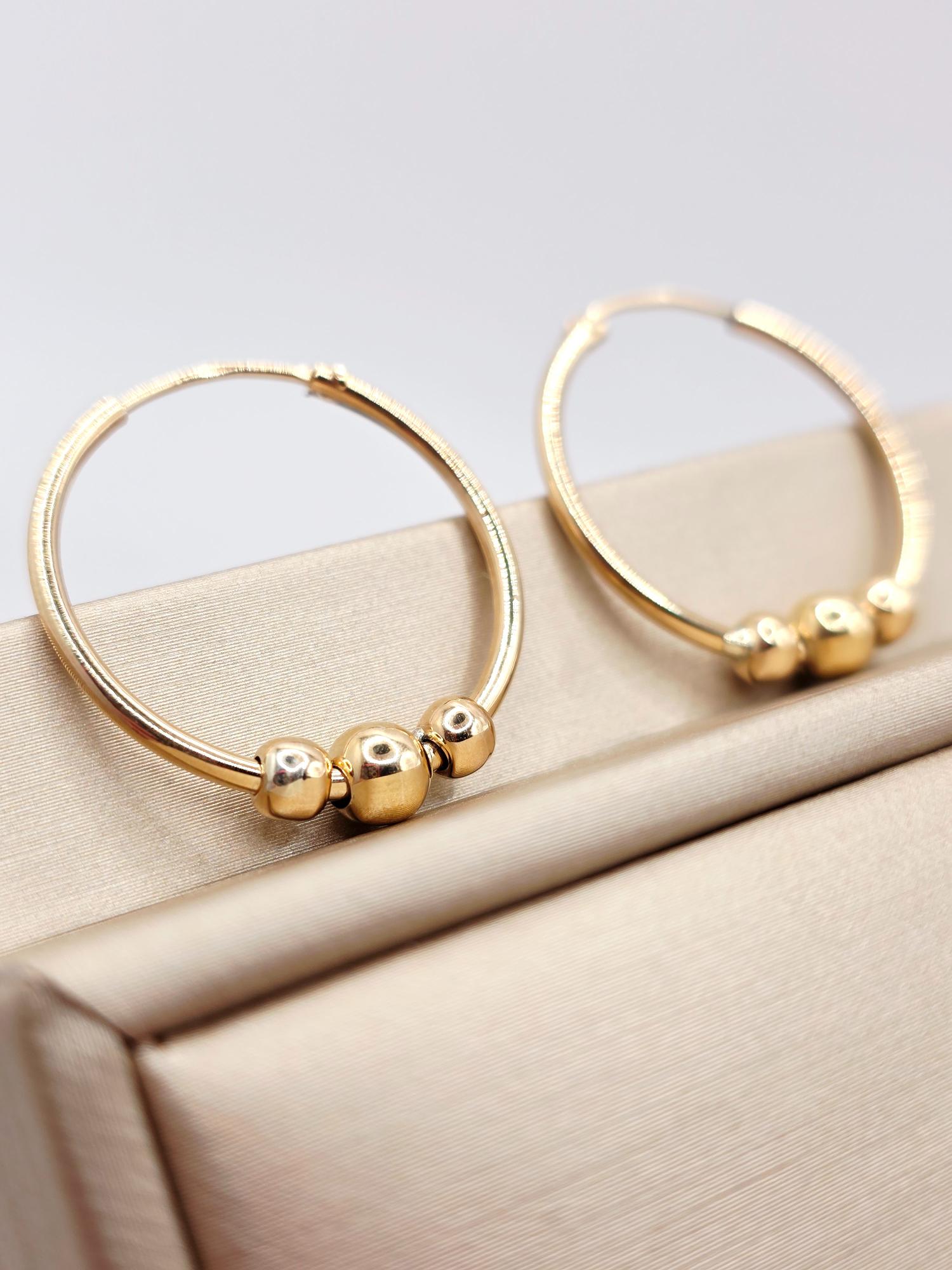 Aros tubo bolas 2.5 cm 2.7 grs Oro 18k 2