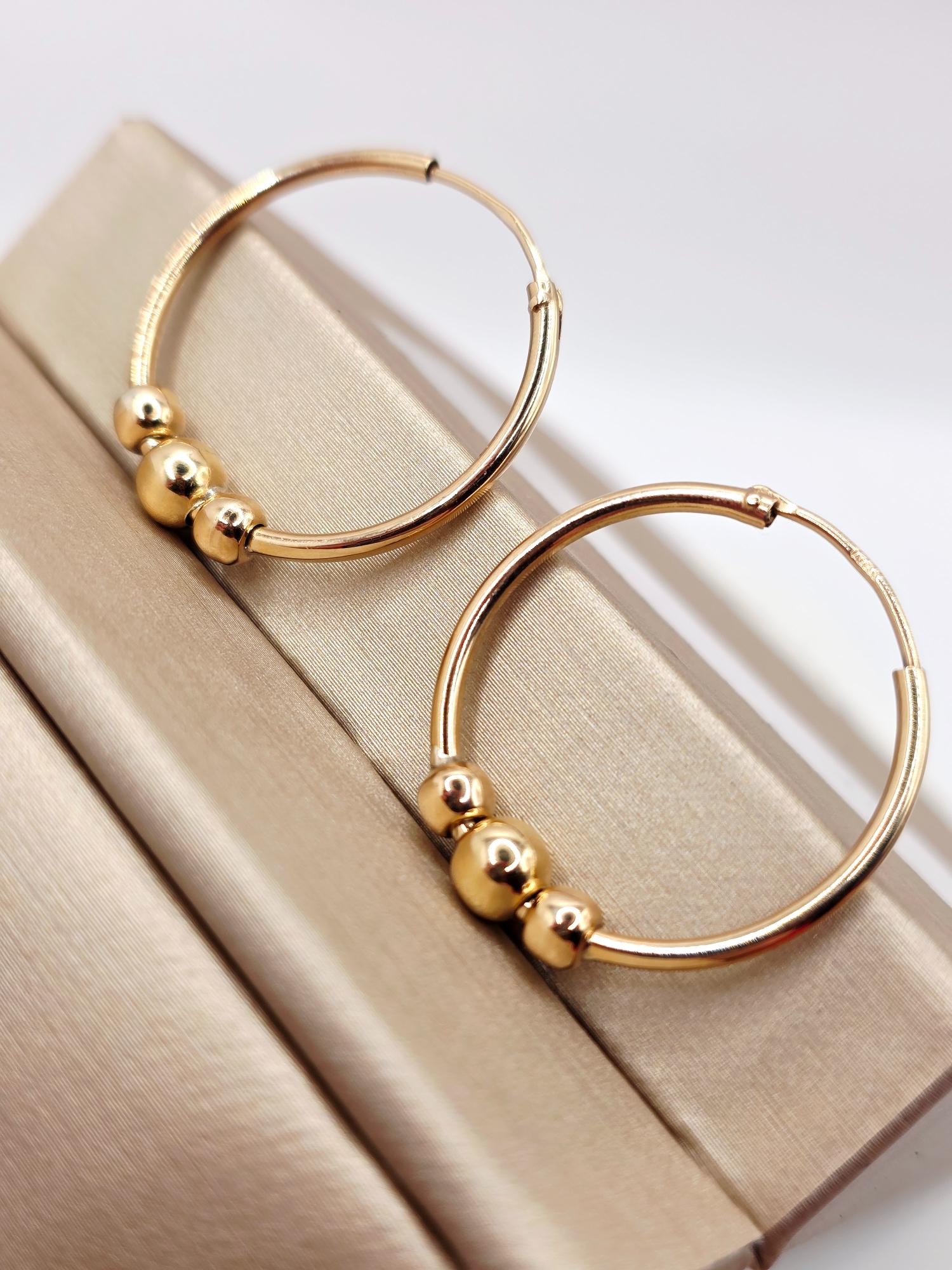 Aros tubo bolas 2.5 cm 2.7 grs Oro 18k 1