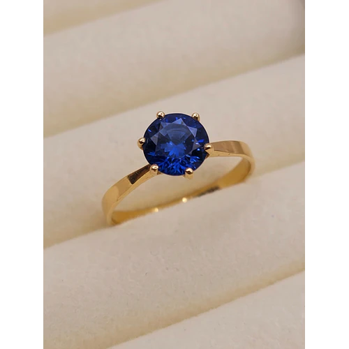 Anillo solitario seis grifas zafiro 2 grs Oro 18k