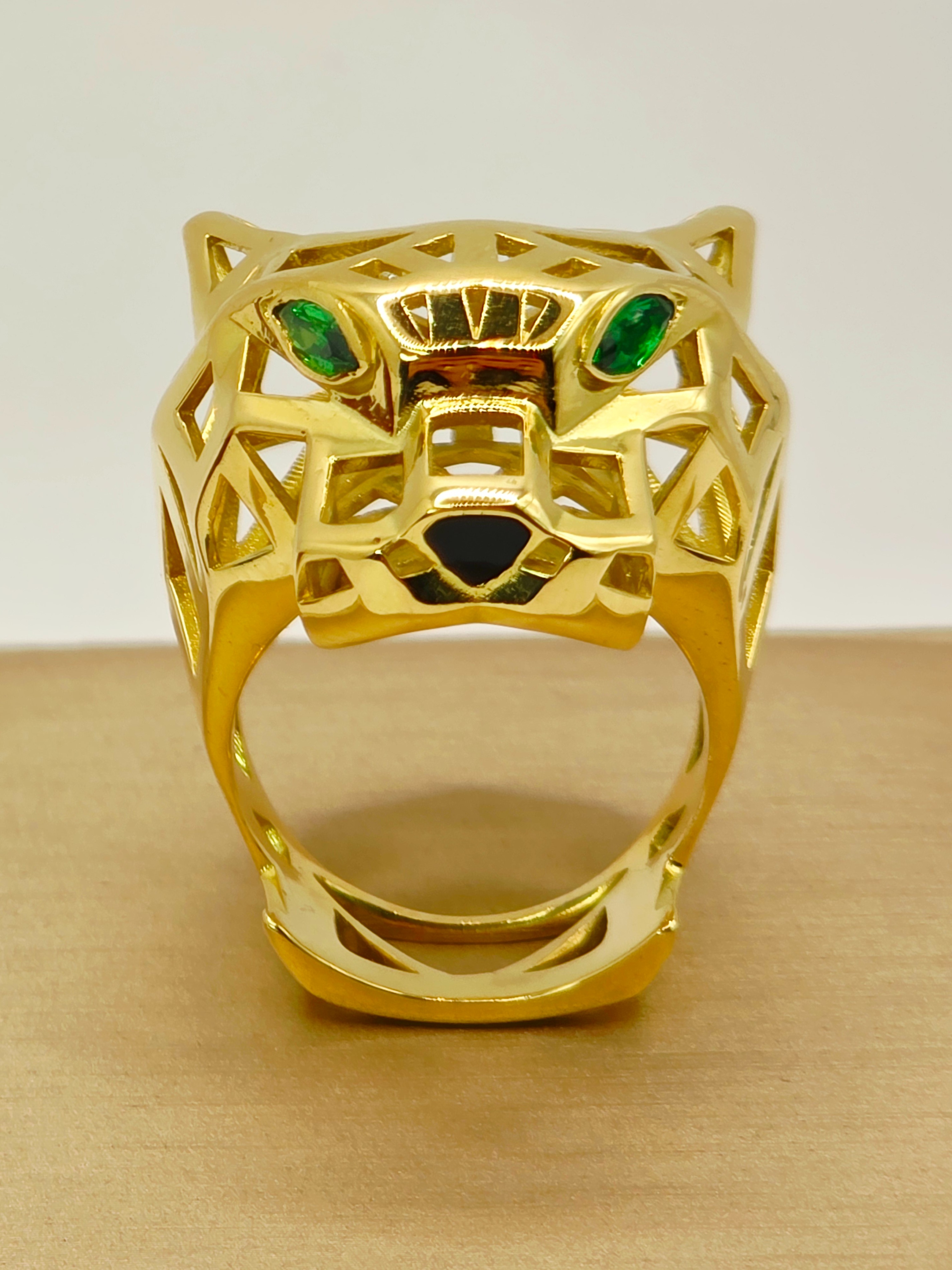 Anillo jaguar esmeraldas y onix 28 grs Oro 18k 1