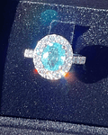 Espectacular Anillo Gran Turmalina Paraiba Ovalada con Halo de Diamantes en Platino