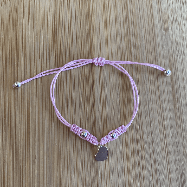 Pulsera de hilo rosada con colgante de corazón 1