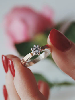 Gold engagement ring with big white diamond