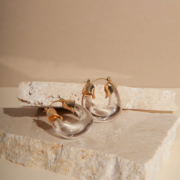 Classic circular transparent earrings with gold details 1