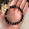 Pulsera femenina elaborada con obsidianas negras, cuarzo ahumado y ónix en acabado mate 1