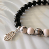 Pulsera elaborada con Jaspe cebra rosa y Turmalina negra, incluye Mano de Fátima en plata ley 925 3