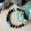 Pulsera unisex confeccionada con Ojo de Tigre, Ágatas Azules y Ónix Negro Mate 1
