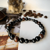 Pulsera masculina creada con Ojo de buey, Ónix negro y Hematitas cilíndricas 1