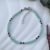 Pulsera femenina creada con Amazonita aqua y Obsidiana negra, con terminaciones en plata ley 925 1
