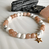 Pulsera femenina creada con Howlitas blancas mate y Piedra de sol facetadas 2