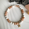 Pulsera femenina creada con Howlitas blancas mate y Piedra de sol facetadas 1