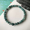 Pulsera masculina creada con Jade azul y Apatitas, con separadores de acero y una Apatita central. 1