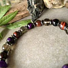 Pulsera masculina creada con Ojo de buey, Cuarzo ahumado, Ojo de gato morado y separadores de Hematitas. 3